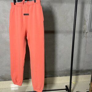 New-Fear-of-God-Essentials-Sweatpant-Coral